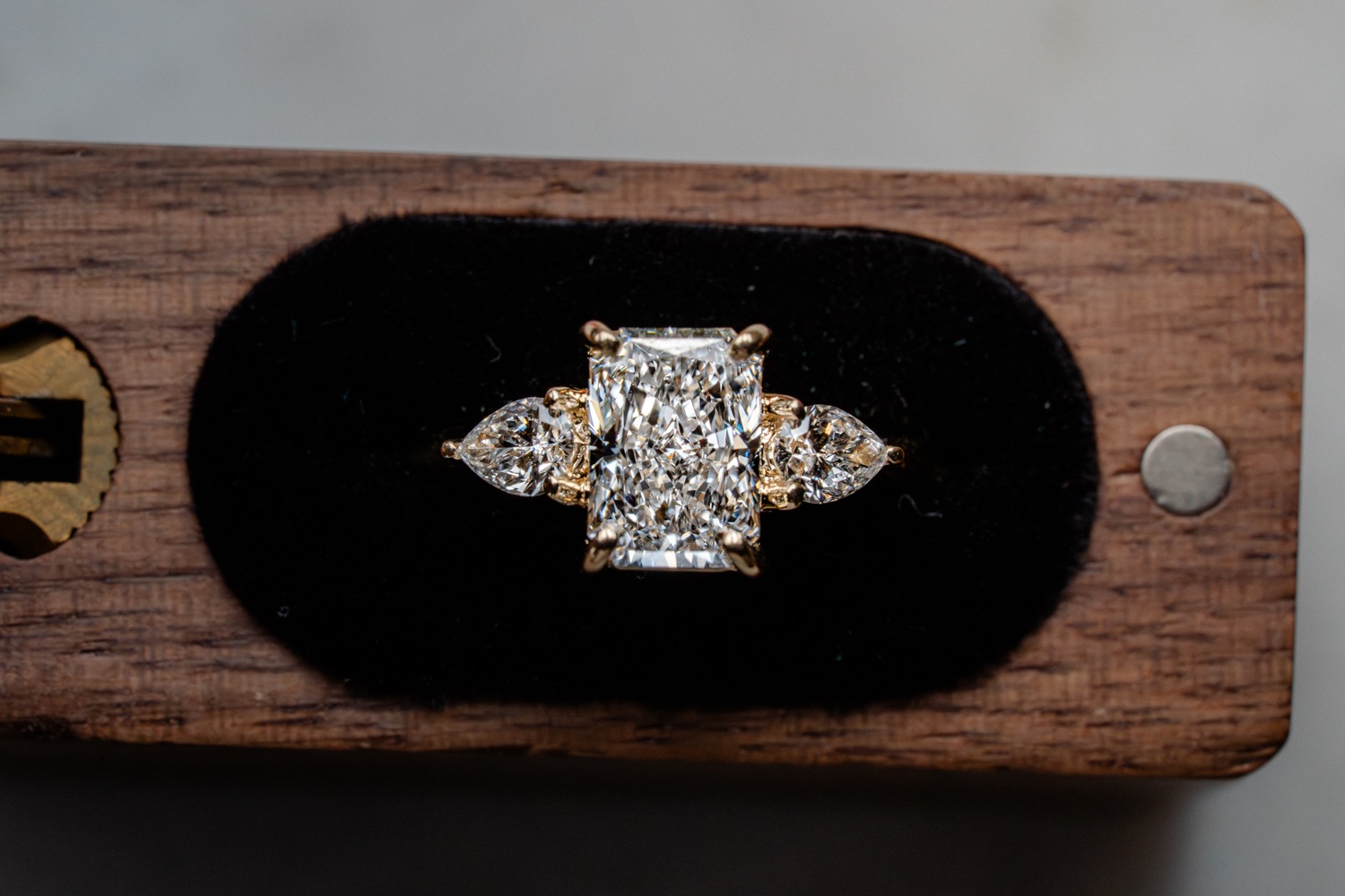 A radiant-cut diamond ring.