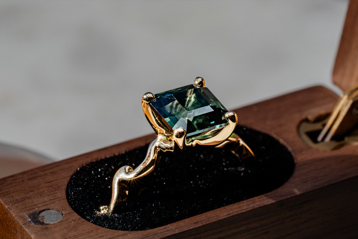 A teal sapphire ring.